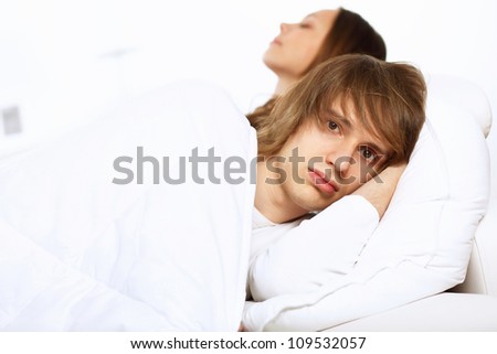 Young man and his wife go to bed