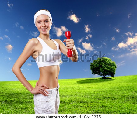 Portrait of a young woman doing sport with sport tool