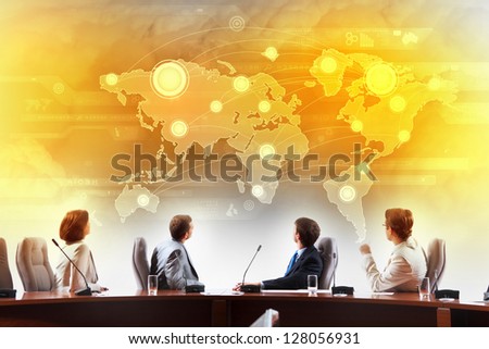 Image of businesspeople at presentation looking at virtual project