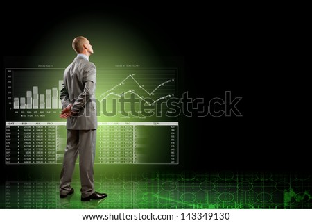 Back view image of businessman with arms crossed behind back