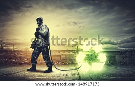 Man in respirator against catastrophe background. Recycle concept
