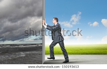 Image of young business man changing reality