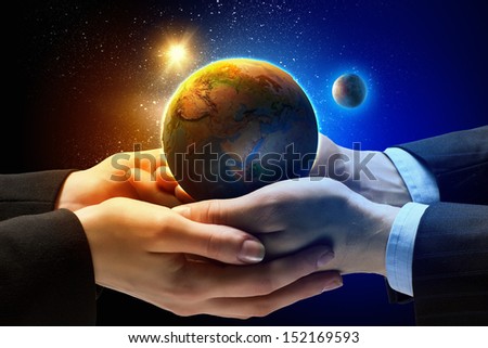 Close up image of human hands holding earth planer. Ecology conceptElements of this image are furnished by NASA