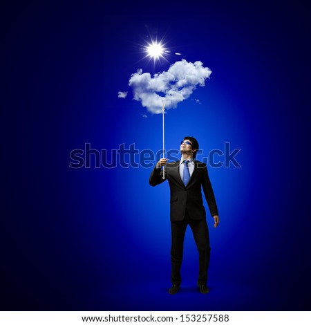 Image of businessman in goggles looking at sun