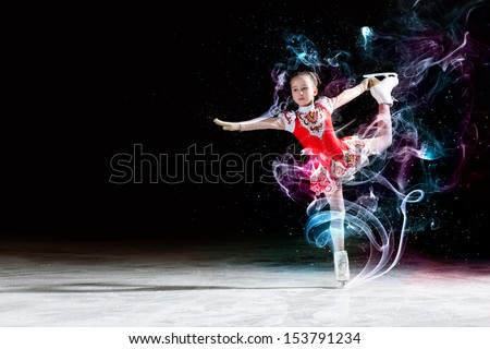 Little girl figure skating at sports arena