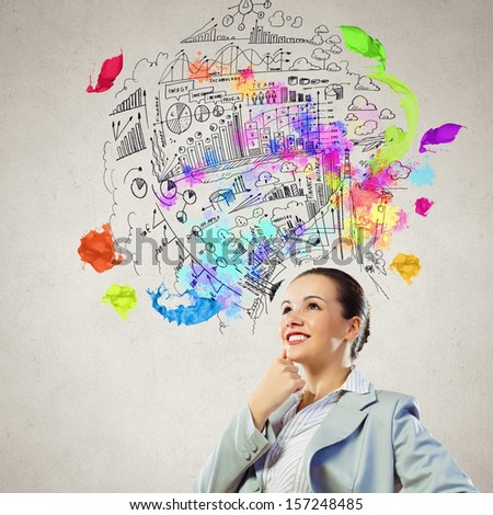 Image of thoughtful businesswoman with business sketch at background