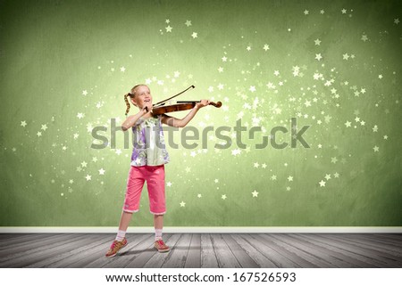 Image of cute girl playing violin against green background