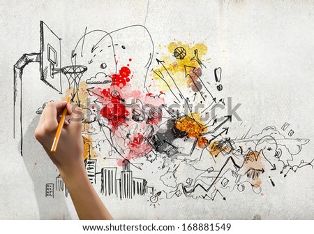 Close up of human hand drawing conceptual sketches
