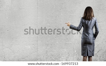 Back view of businesswoman in business suit