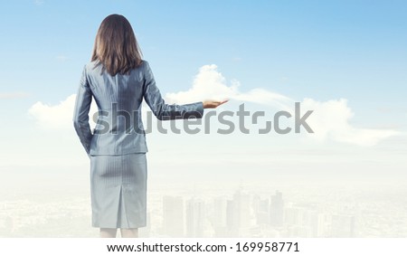 Back view of businesswoman in business suit