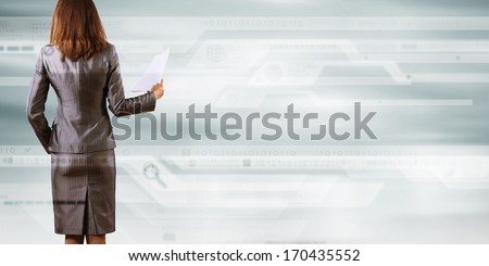 Back view of businesswoman holding papers in hands