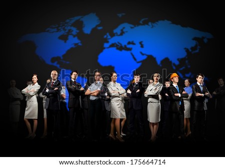 Group of businesspeople standing together against a world map background