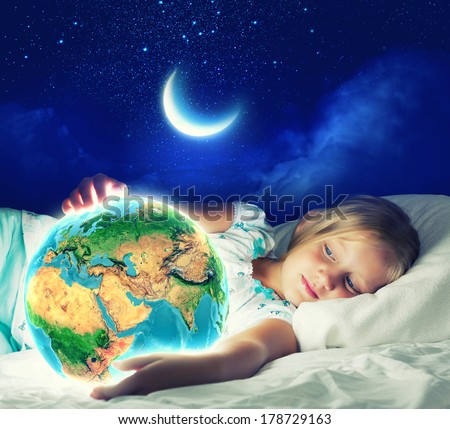 Girl in bed with Earth planet in hands. Elements of this image are furnished by NASA