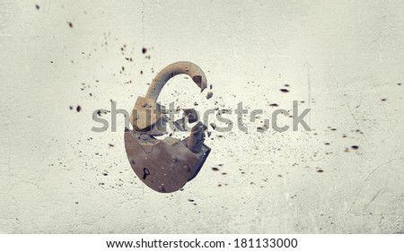 Conceptual image with stone broken lock on white background