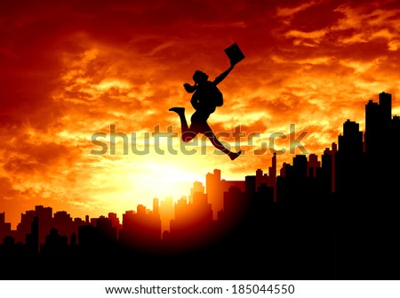 Silhouette of businesswoman jumping above city against sunset background