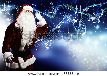 Santa Claus enjoying the sound of music