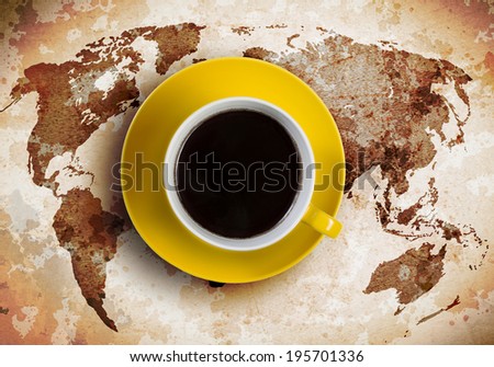 Cup of coffee with world map at background