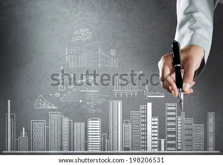 Close up of businesswoman hand drawing business sketches