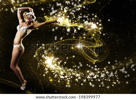 Young woman in white bikini dancing against color background