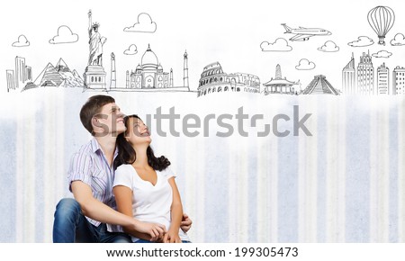 Young couple hugging each other and dreaming about future