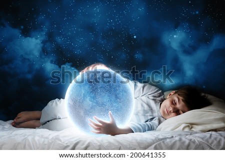 Cute boy sleeping in bed with moon