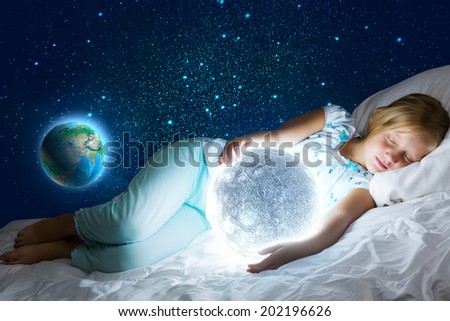 Girl lying in bed with moon in hands. Elements of this image are furnished by NASA