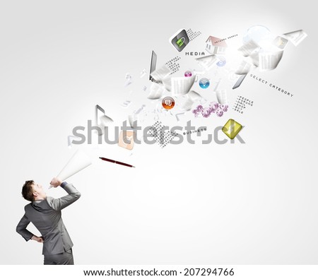 Young businessman speaking in trumpet and colorful icons flying out