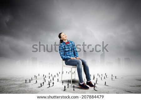 Woman in casual sitting on chair and many small silhouettes of businesspeople around
