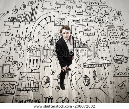 Top view of young businessman with tie around head