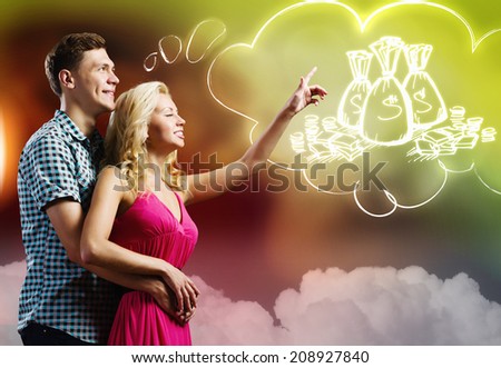 Young happy couple dreaming about family wealth