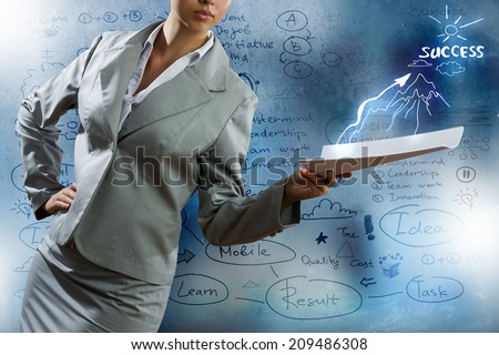 Businesswoman holding papers in hand and business sketches at background