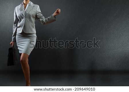 Bottom view of businesswoman holding pen in hand