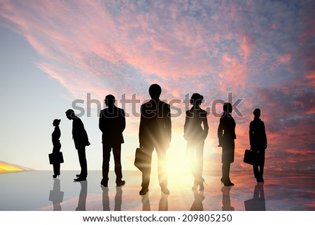 Silhouettes of business people standing in line