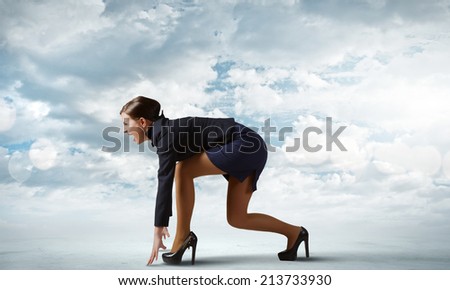 Side view of businesswoman standing in start position