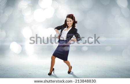 Young funny woman in suit against bokeh background