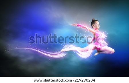 Little cute girl gymnast making high jump