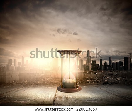 Conceptual image with huge sandglass. Time concept