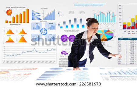 Young businesswoman and statistics information on table