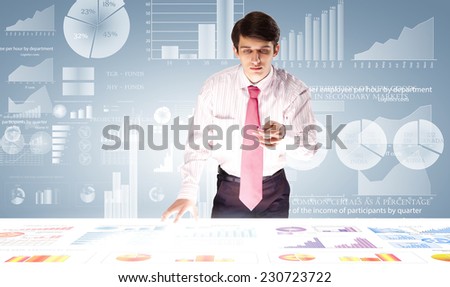 Young businessman and statistics information at background