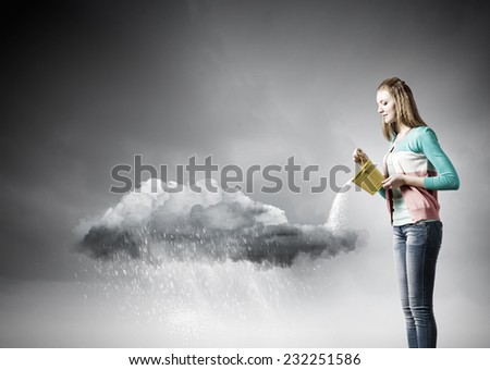 Young woman pouring water from bucket on cloud