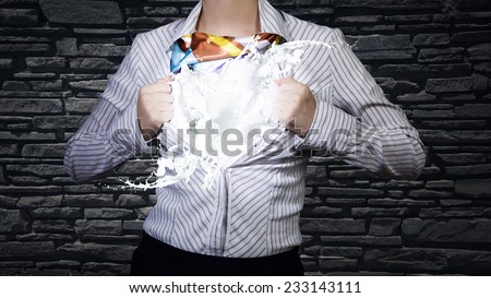 Young woman tearing shirt on chest. Idea concept