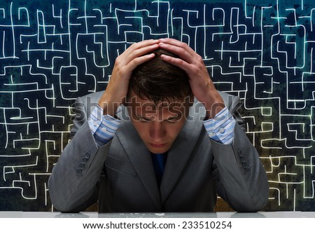 Depressed tired businessman with hands on head