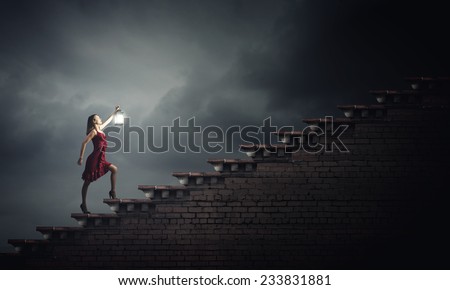 Young girl in red dress walking on stair case