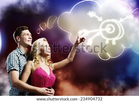 Young happy couple dreaming about future successful life