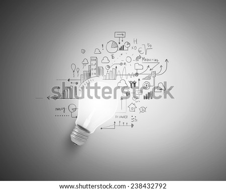 Conceptual image of light bulb and business sketches