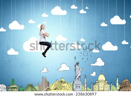 Young pretty girl riding on cloud high in sky