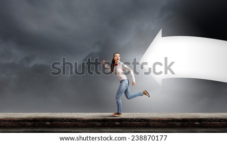 Young woman in casual running in a hurry