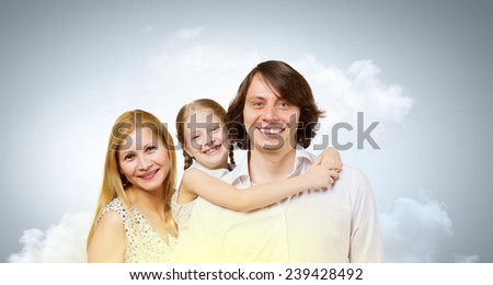 Happy family portrait of mother father and daughter