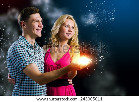 Young happy couple hugging each other and dreaming about future
