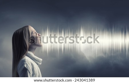 Side view of girl of school age and voice coming out of her mouth